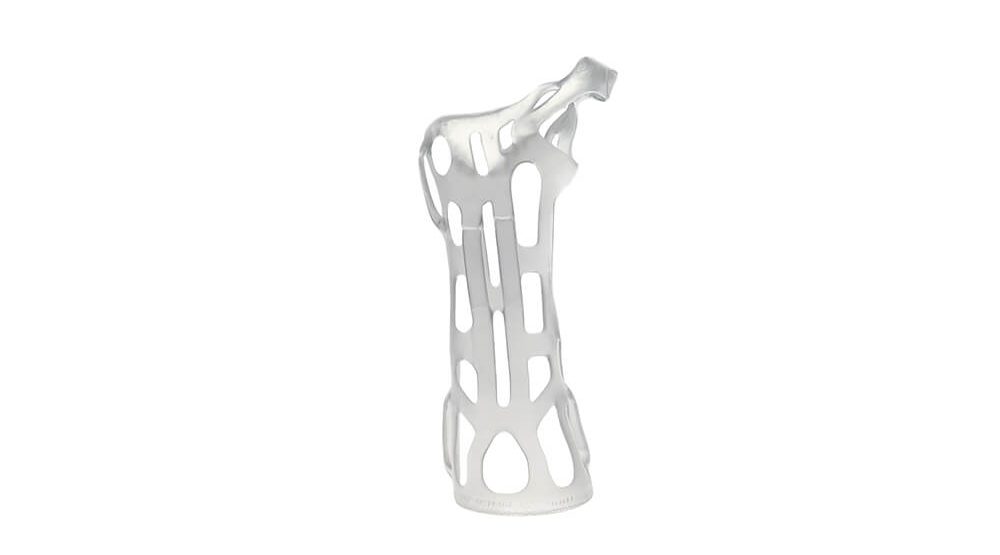 A white polycast with an irregular lattice structure printed with Ultracur3D® ST45 against a white background.
